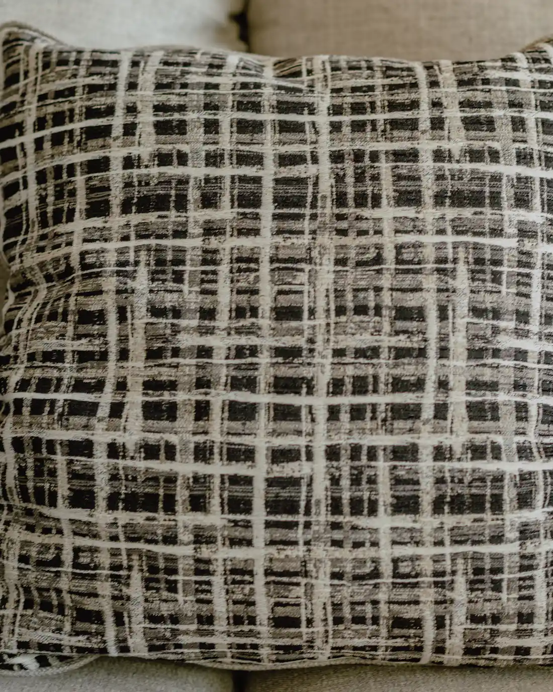 PLACEHOLDER: a white and black cushion, standing in for the white colorway in daylight.